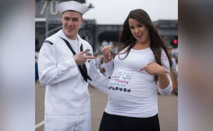 Chris and Natasha show off the pregnant belly.