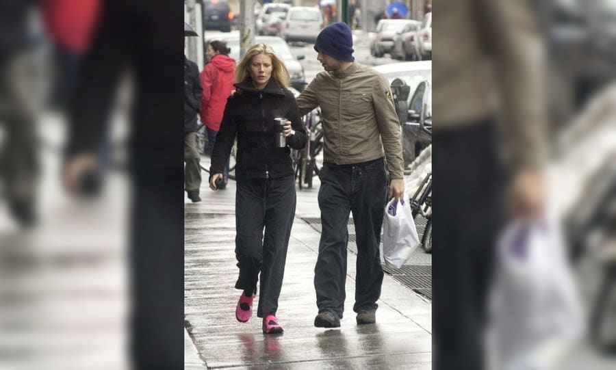 Actress Gwyneth Paltrow walks with her boyfriend musician Chris Martin