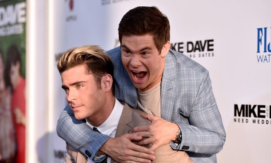 Actors Zac Efron (L) and Adam Devine