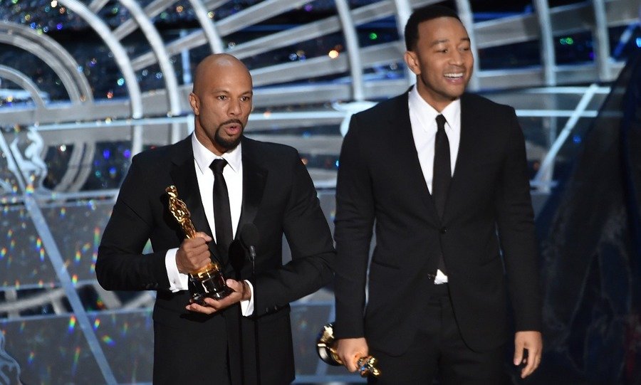 Musicians Common (L) and John Legend accept the Best Original Song Award