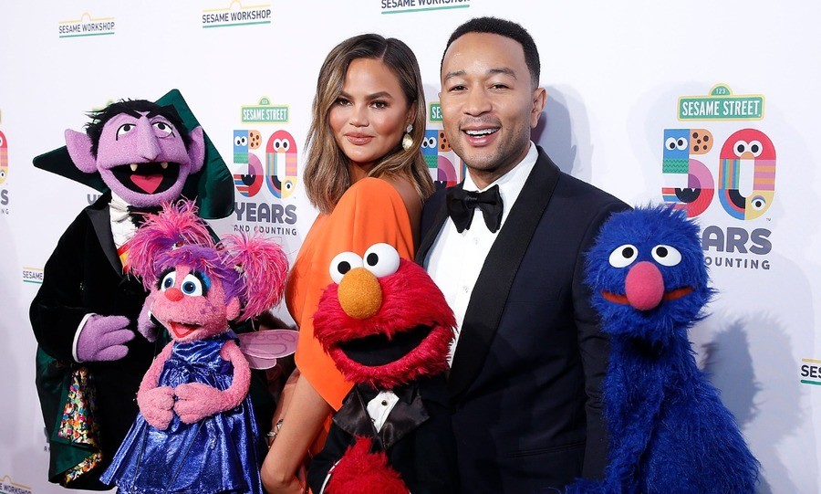 Chrissy Teigen and John Legend attend Sesame Workshop