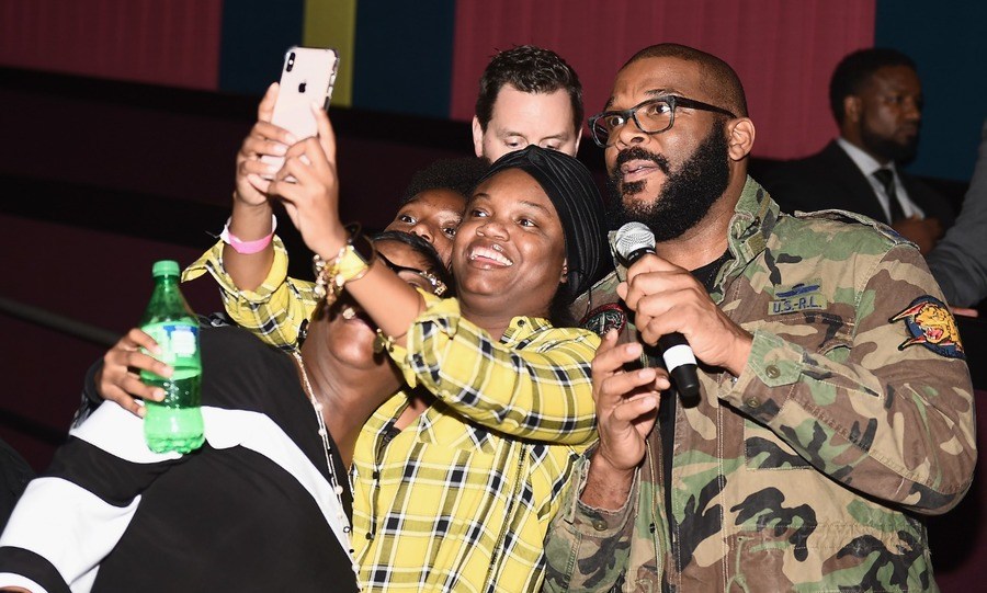 Tyler Perry takes a selfie with fans