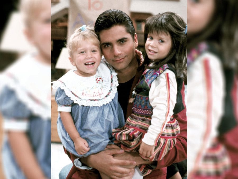 Mary-Kate and Ashley Olsen with John Stamos in 1989.
