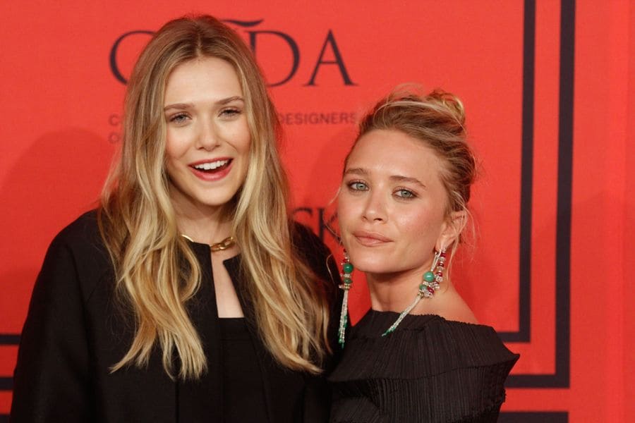 Elizabeth Olsen with Mary-Kate at the Fashion Awards in 2013.
