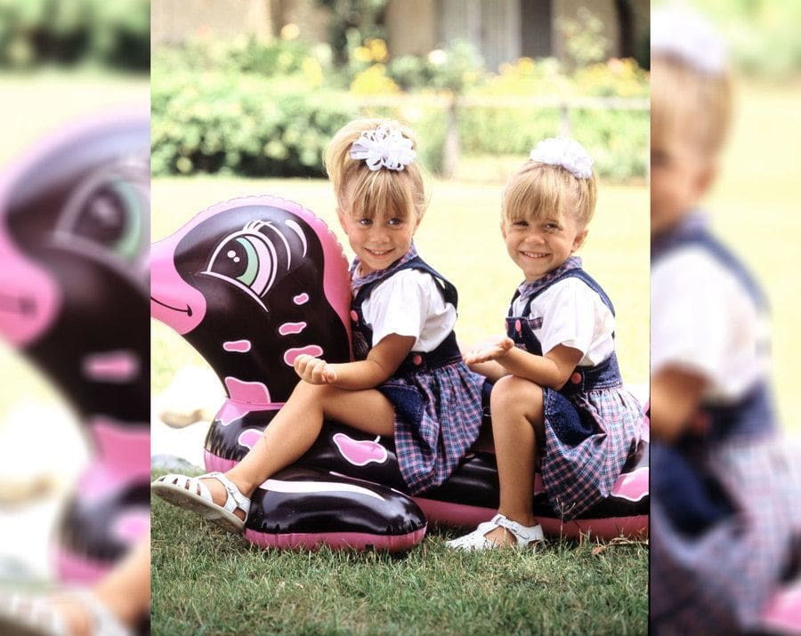 Ashley and Mary-Kate Olsen on a blow-up pool toy in 1989.